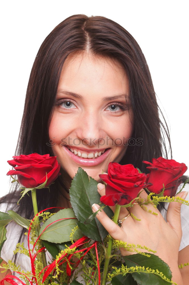 Similar – Redhead woman smelling a flower in a park