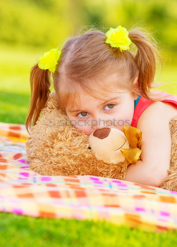 Similar – Young girl cuddles stuffy