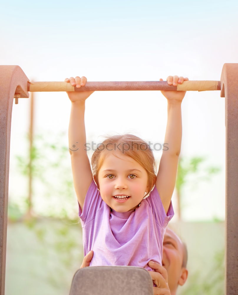 Similar – Cute black boy having fun on a swing in his parents garden