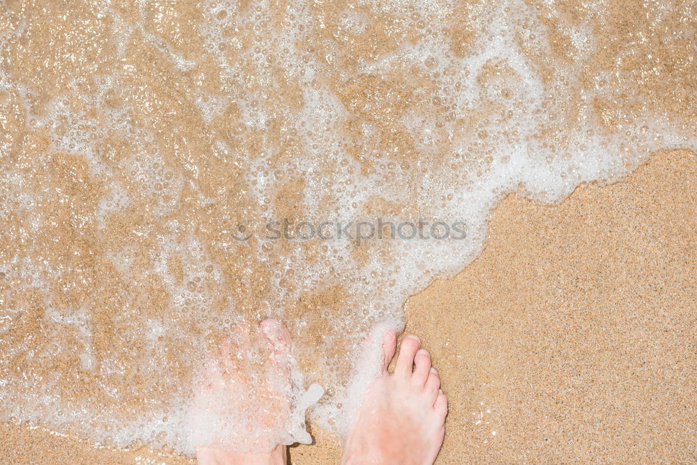 Similar – Image, Stock Photo Feet of a woman on a sandy beach on the Atlantic Ocean