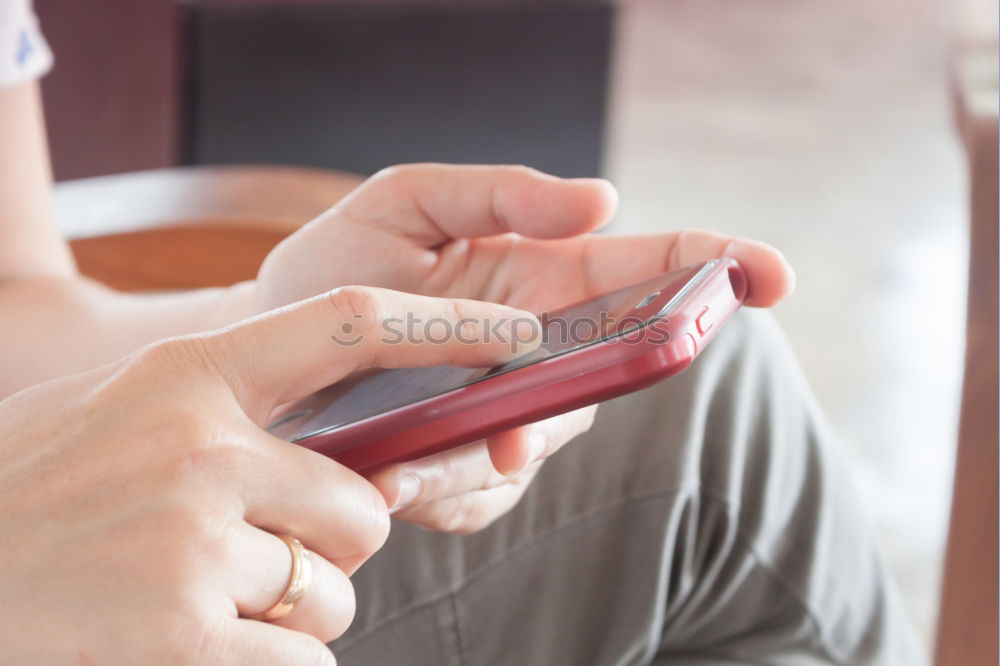 Similar – Close up of hands using smartphone