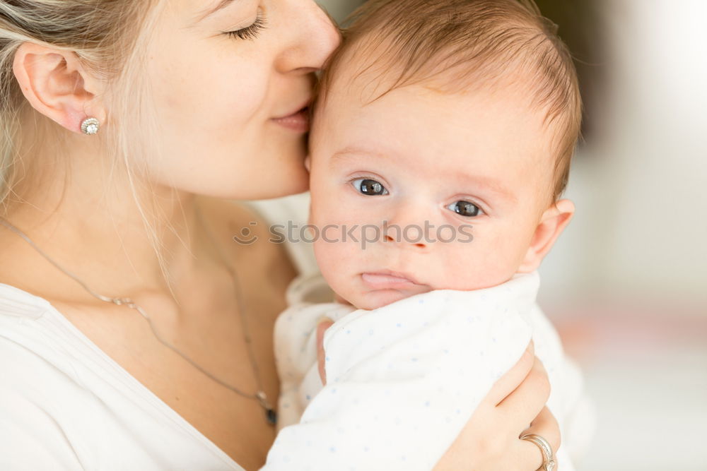 Image, Stock Photo Portrait of a mother with her baby at home.