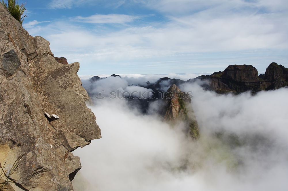 Similar – Rock climbing team bivouaced in a storm.