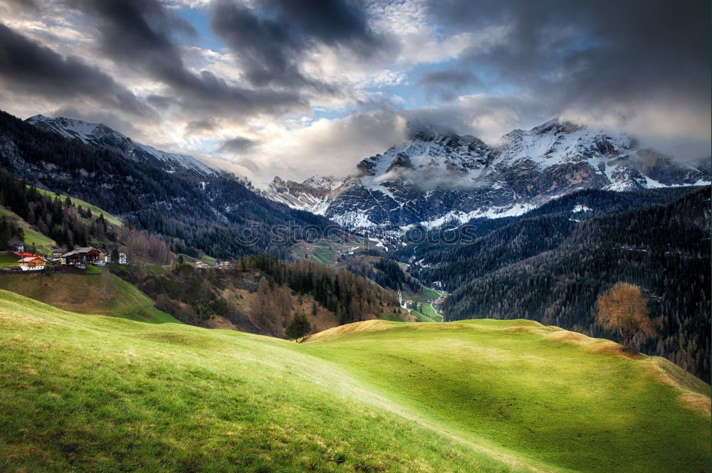 Similar – Image, Stock Photo Snow caped mountains and green fields and meadows