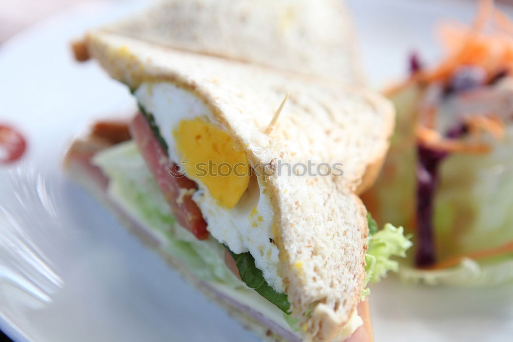 Similar – Image, Stock Photo Fresh healthy sandwich with bread, ham and vegetables.