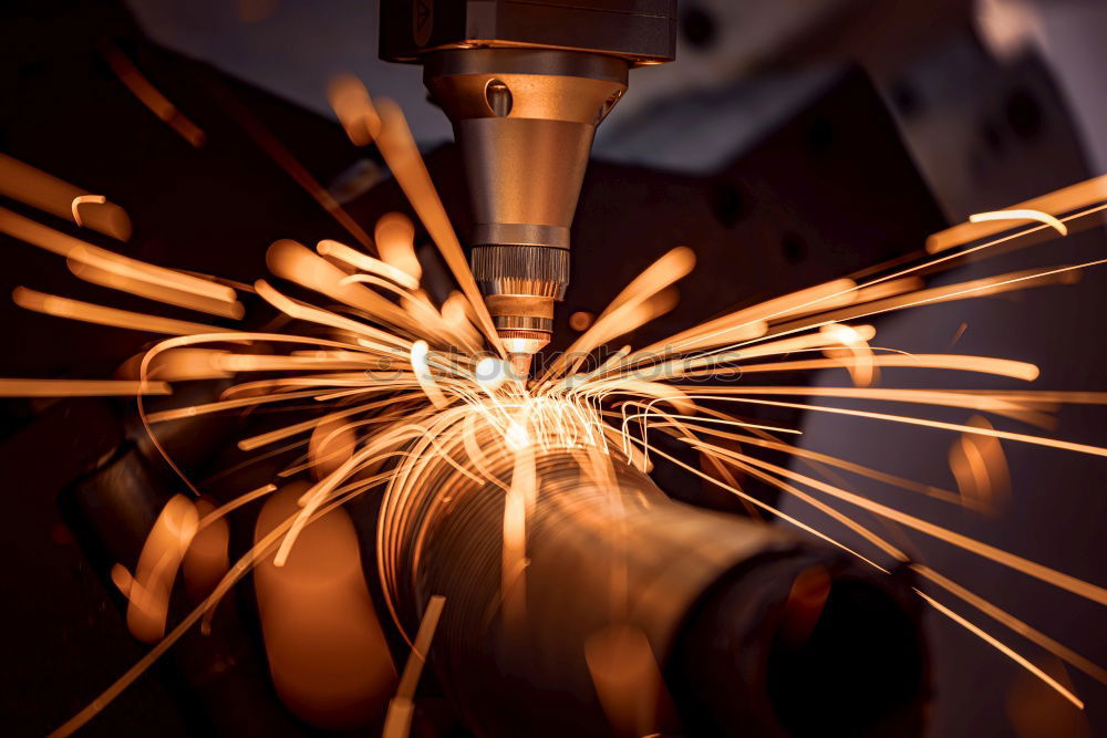 Similar – worker using an angle grinder