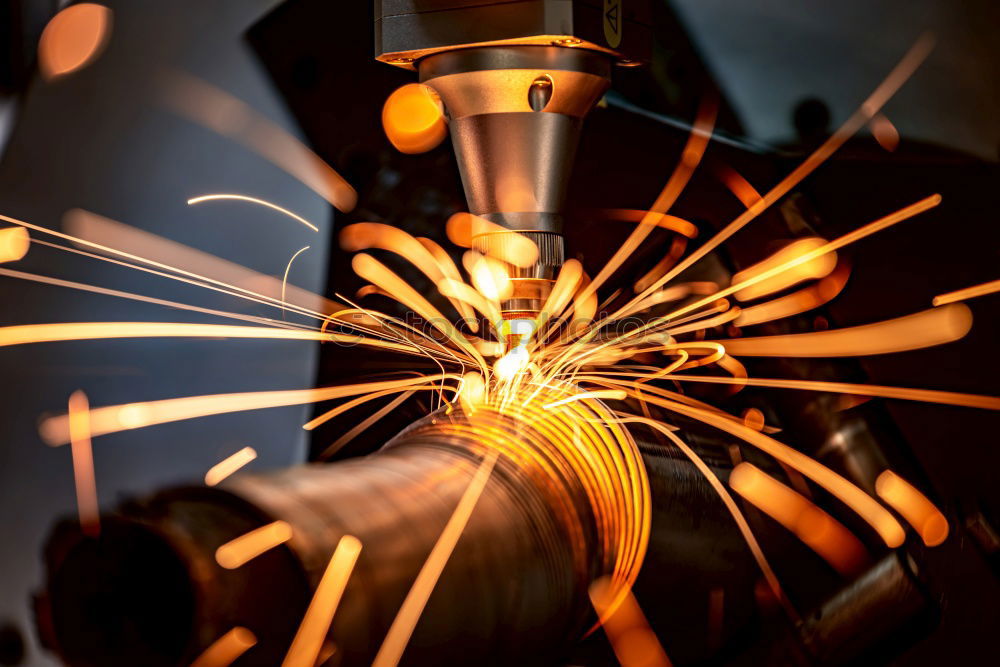 Similar – worker using an angle grinder