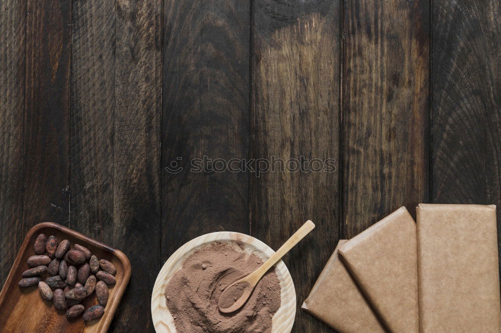 Similar – Brown wooden background with black frying pan