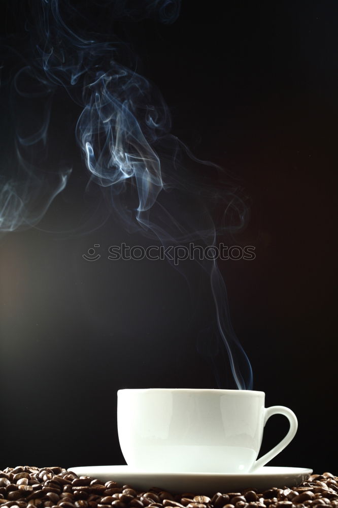 Poring hot coffee in an enamel cup