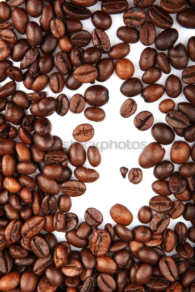 Similar – Coffee beans on wooden table background