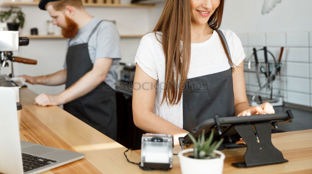 Similar – smiling Barista girl prepares coffee