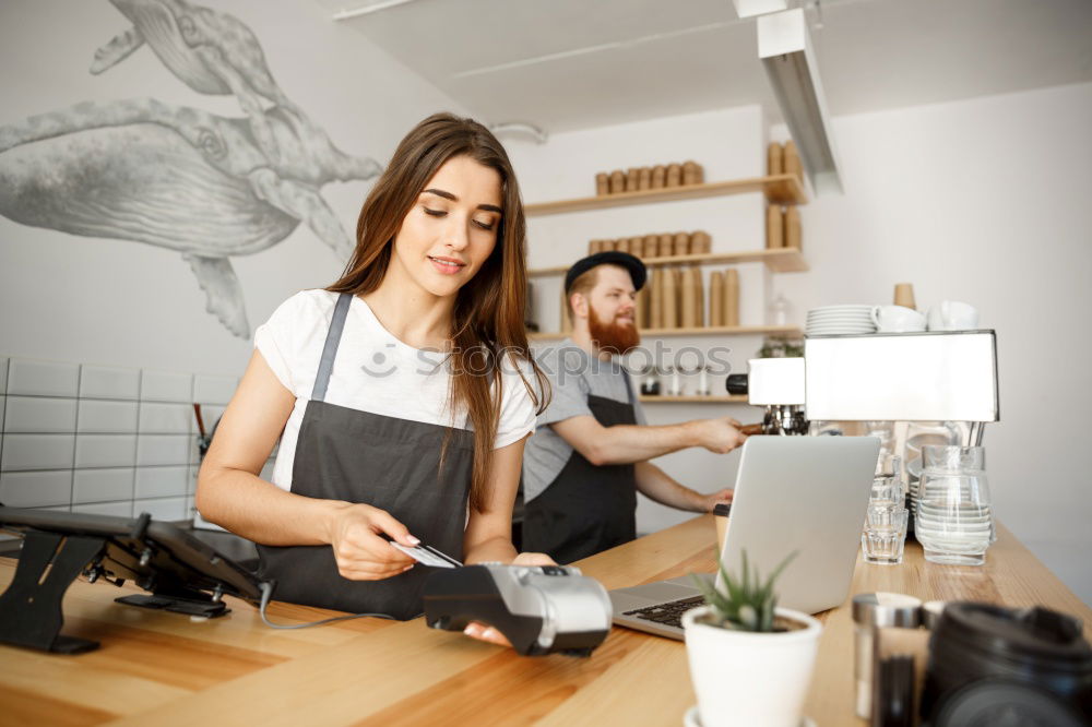 Similar – smiling Barista girl prepares coffee