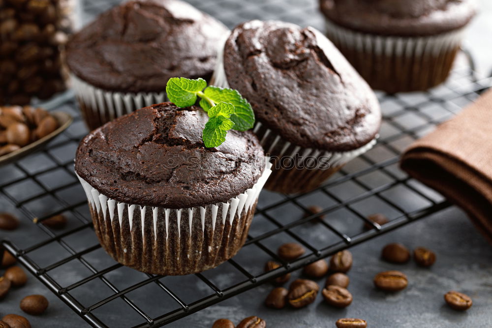 Similar – Image, Stock Photo white etagere with chocolate cake muffin and its preparation