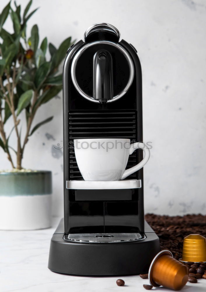 Similar – Glass coffeepot, white porcelain filter, light brown filter paper and dark brown continuous bubble forming coffee, apple, egg in wooden egg cup, white cup, corn waffles, white table in front of grey wall in the morning light.