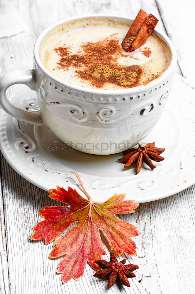 Similar – Tea cup with heart and falling colorful autumn leaves