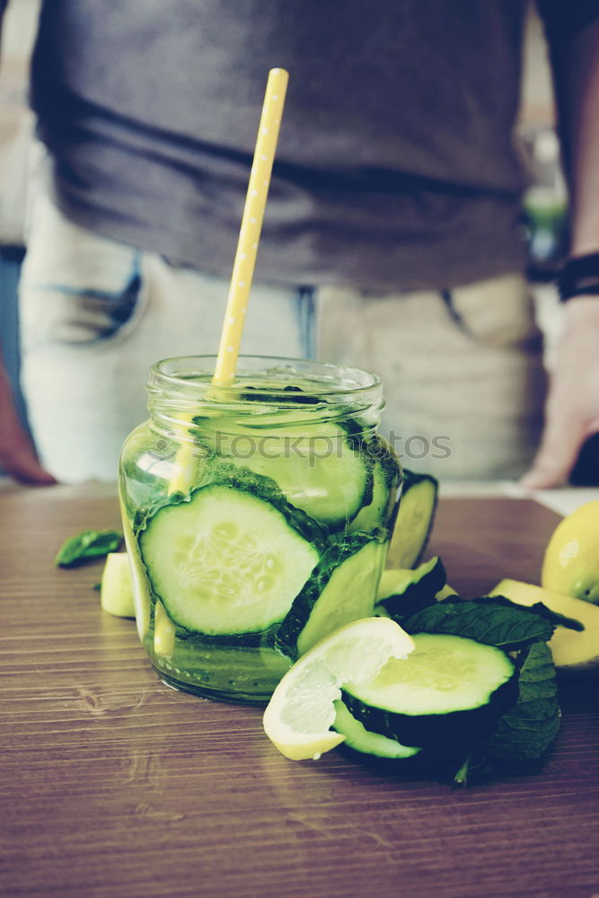 Similar – Image, Stock Photo Lime juice in bottle with fruits and juicer