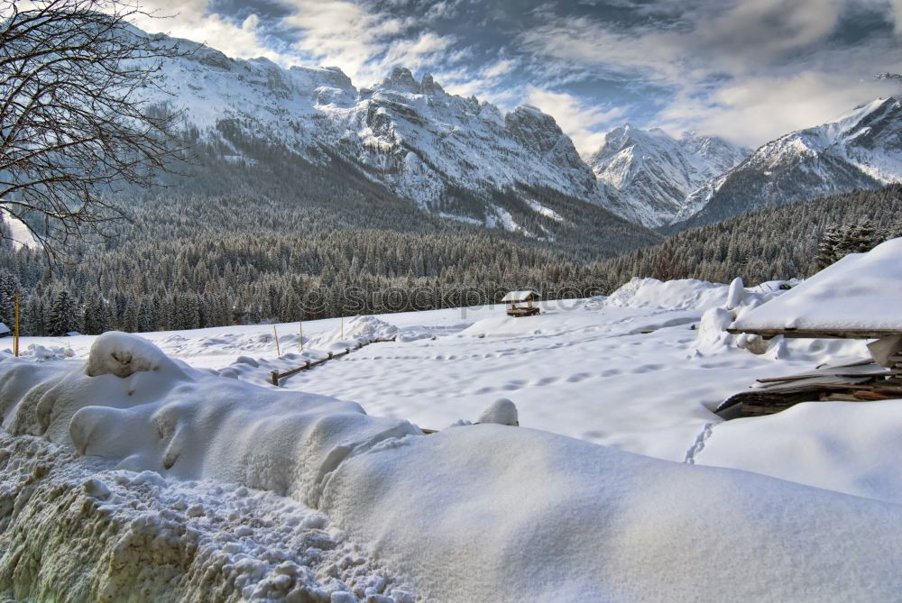 Similar – Snow-capped mountains and frozen river