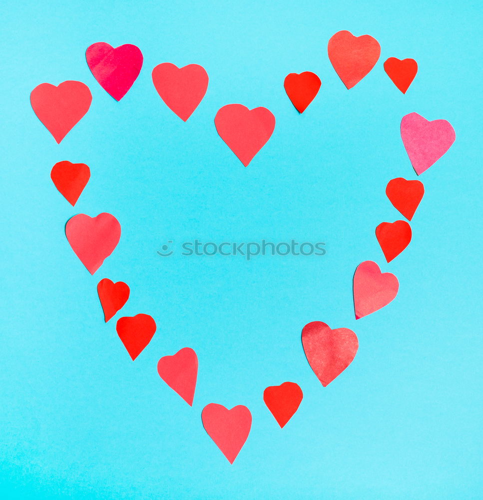 Similar – Image, Stock Photo Three stitched toy hearts, pink, red and teal on blue felt