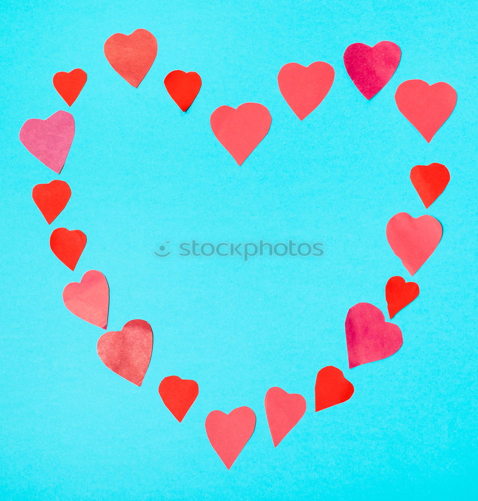 Similar – Image, Stock Photo Three stitched toy hearts, pink, red and teal on blue felt