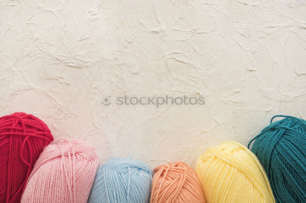 Similar – colourful washcloths hang in a row from the heating in the bathroom