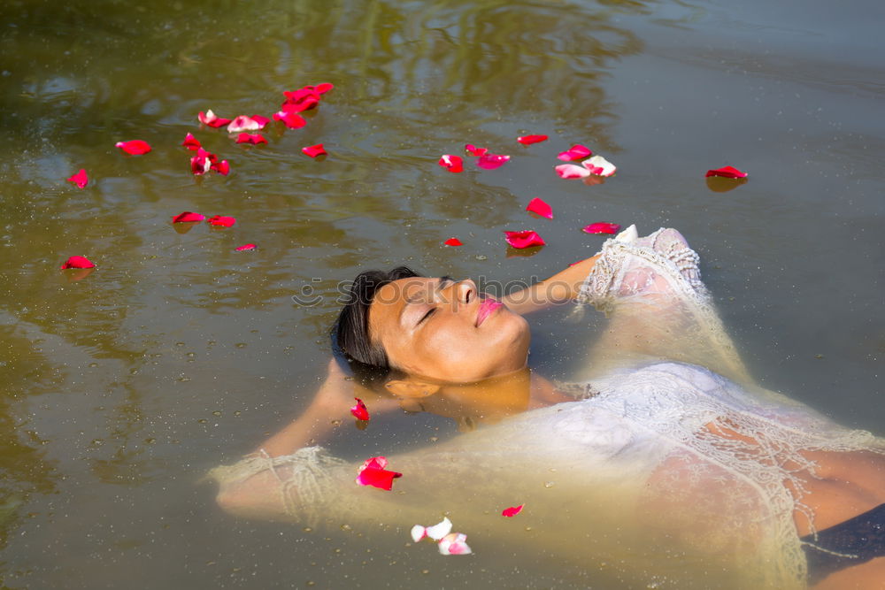 Similar – Image, Stock Photo Portrait of a young blonde woman in a white summer dress in a lake on the surface