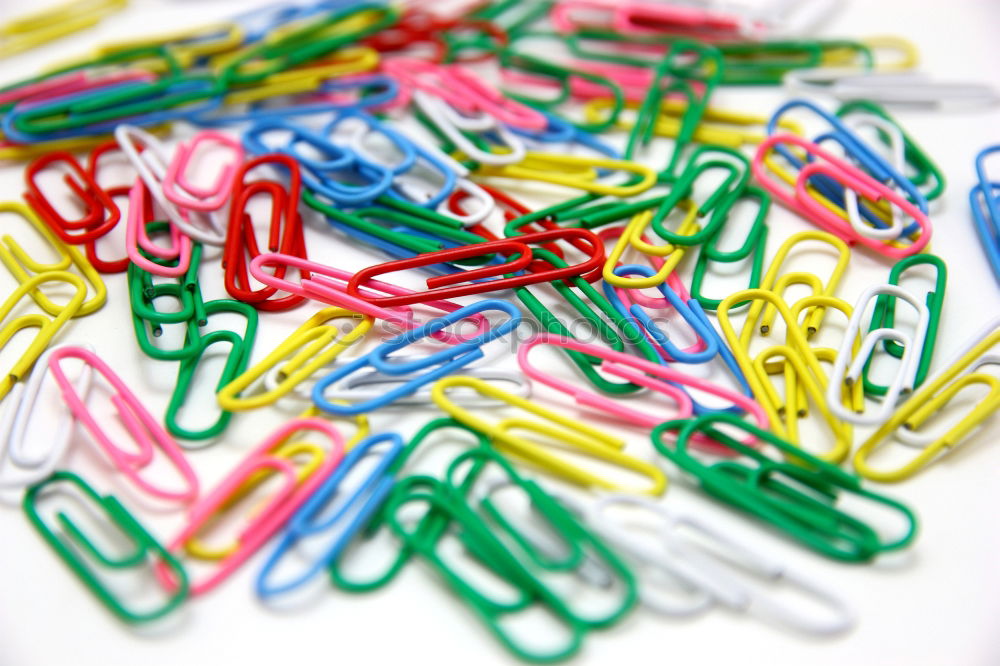 Similar – three coloured scissors in a round wire container in front of a yellow background