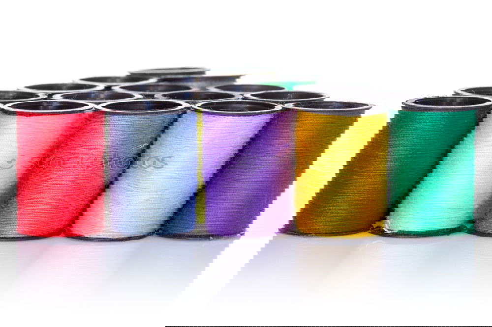 Similar – Image, Stock Photo Five old sewing thread thread rolls in pastel colours on wood