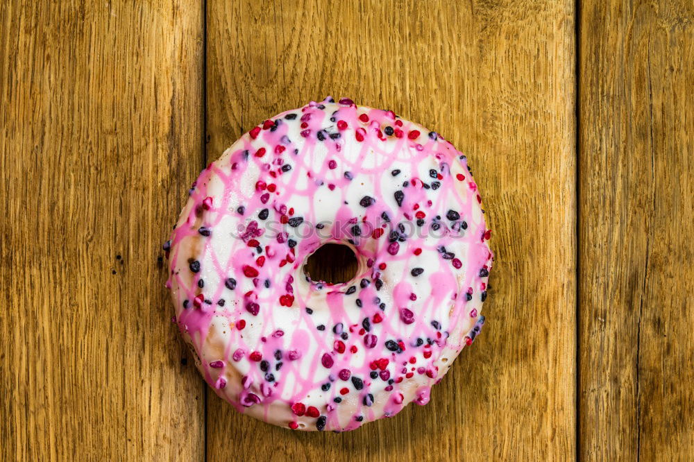 Similar – Sugar sweet donut on pink background