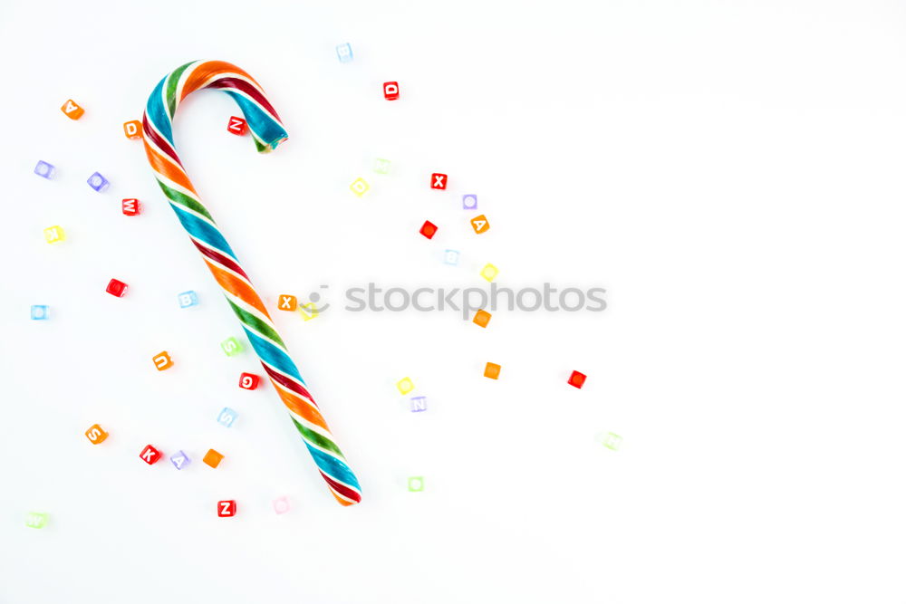 Similar – Moose figure decorated with small colourful sugar balls on turquoise background