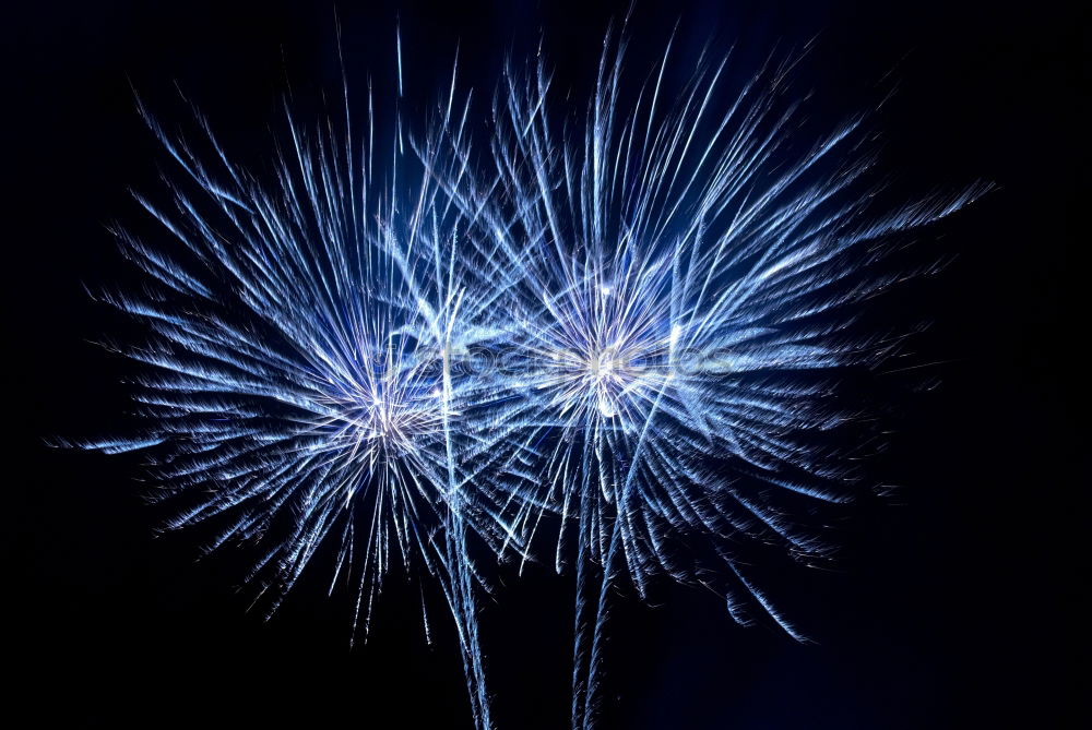 Similar – Blue fireworks with water reflection