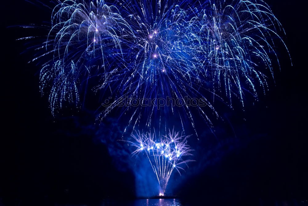 Similar – Colorful fireworks with water reflection