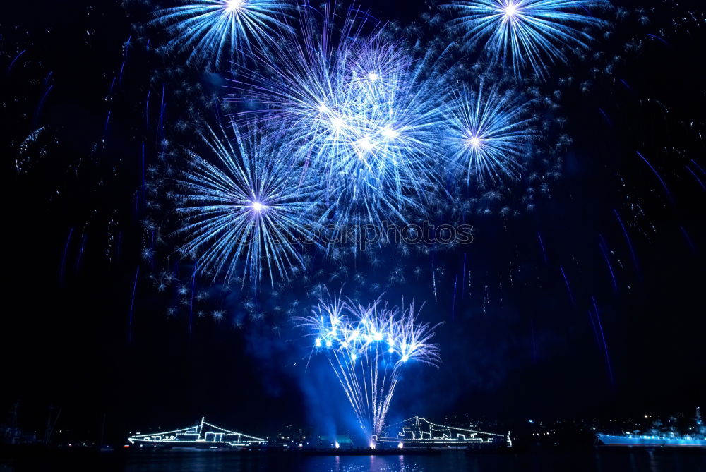 Similar – Colorful fireworks above a lake