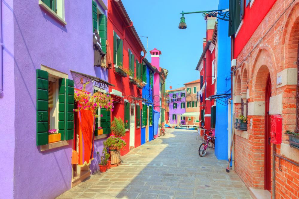 Similar – Image, Stock Photo Destroyed bicycle leaning colored house in Burano, Italy.