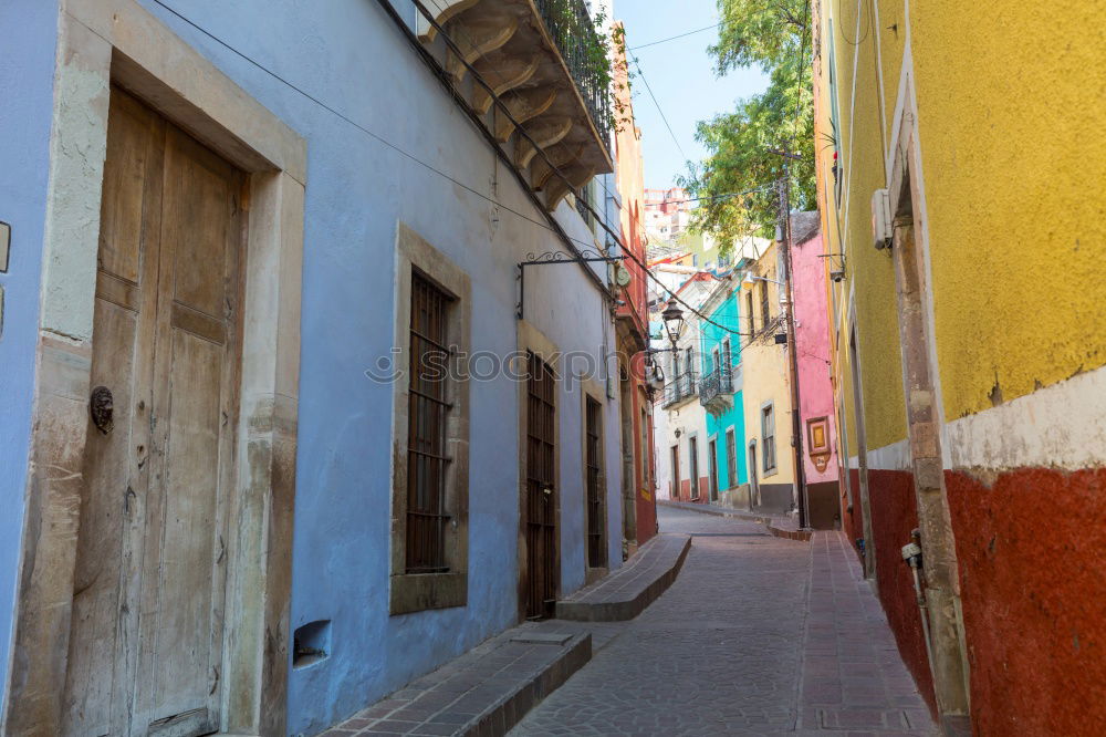 Similar – Image, Stock Photo pretty colorful alleyway in Havana with view to the harbour