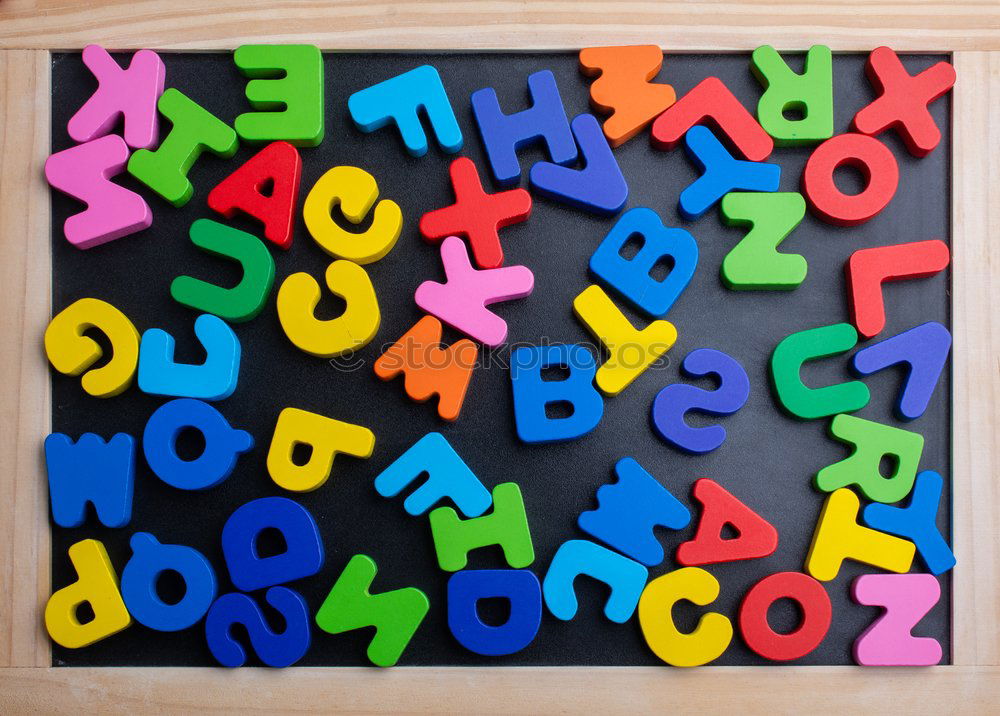 Similar – Colorful letters on wooden board