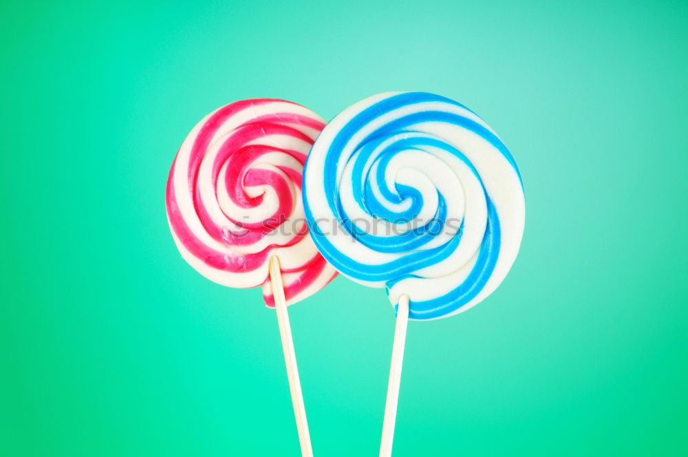 Similar – Image, Stock Photo Colorful lollipops on blue background. Top view.