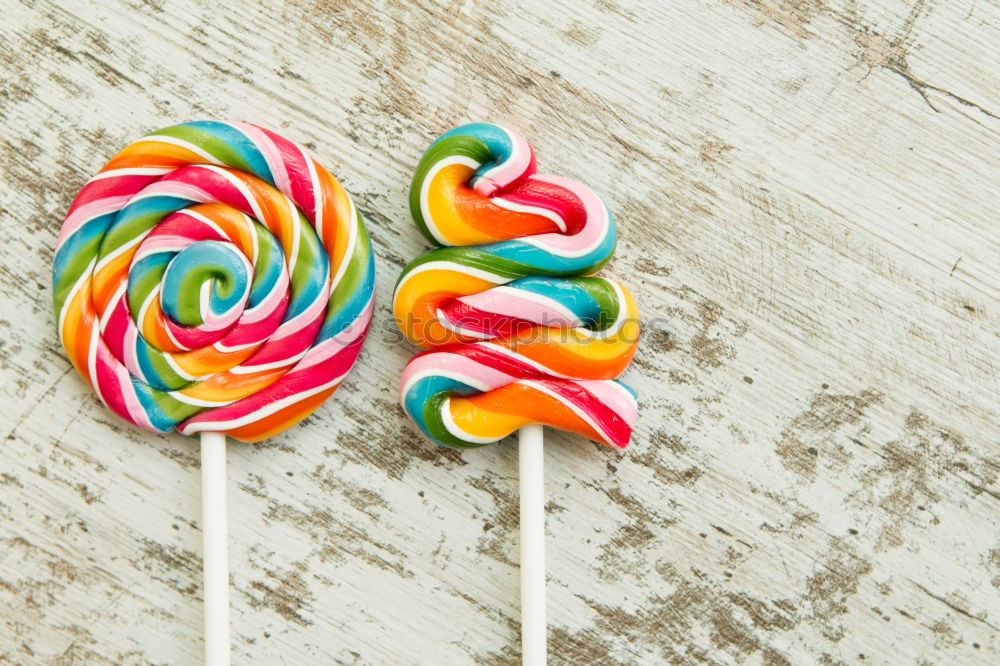 Similar – Colorful lollipops on blue background.