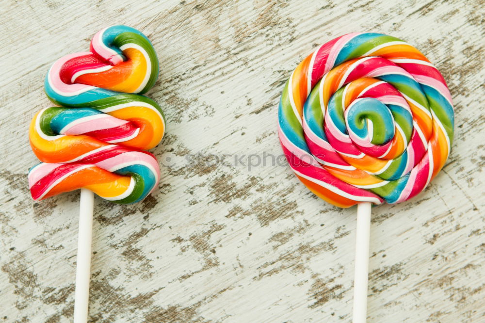 Similar – Colorful lollipops on blue background.