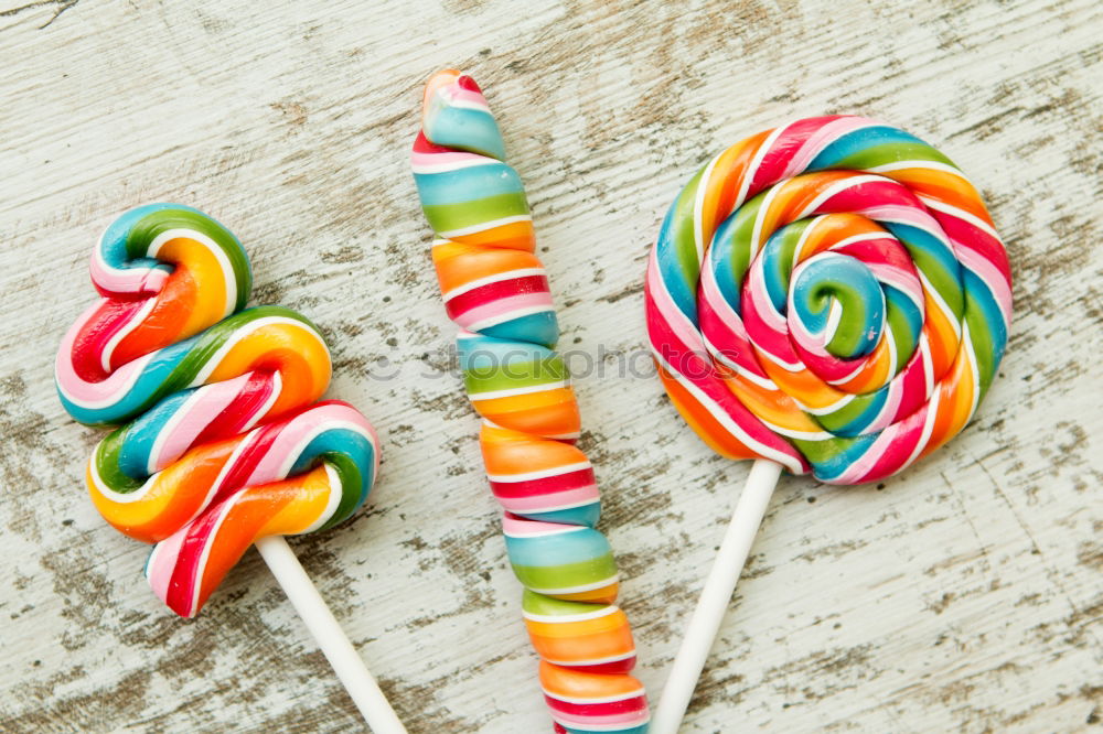 Similar – Colorful lollipops on blue background.