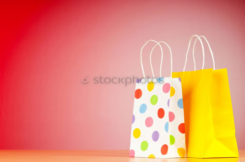 Similar – Paper bag full of black and red gifts