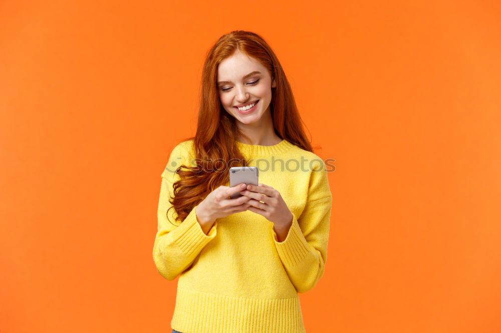 Similar – Portrait of beautiful young woman using mobile phone in the street.