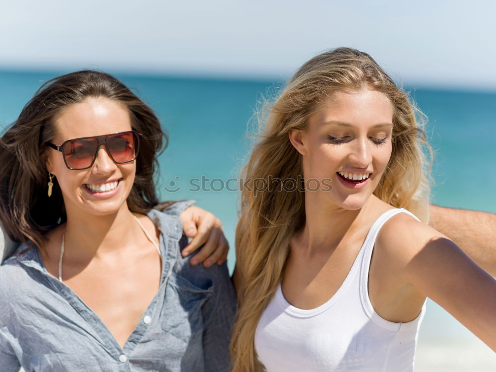 Similar – Image, Stock Photo Two women on the sand of a tropical beach