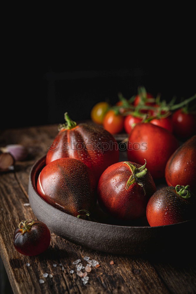 Similar – Image, Stock Photo Colorful tomatoes on the kitchen table with basil