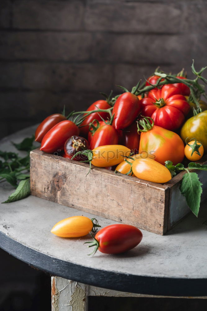 Similar – Image, Stock Photo Colorful tomatoes on the kitchen table with basil