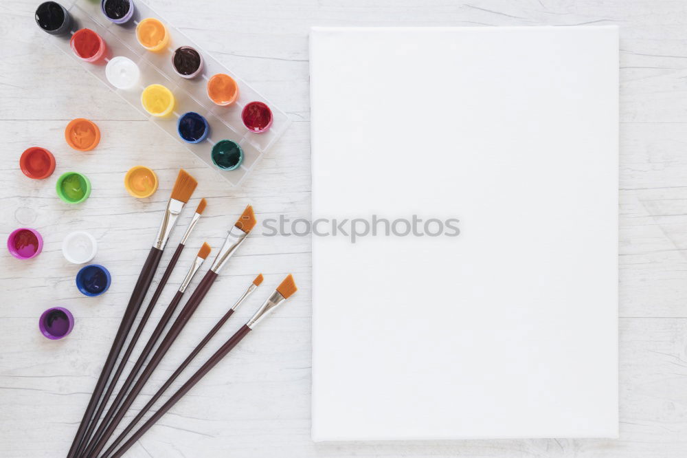 Similar – Garden tools with flower parts on empty notebook .