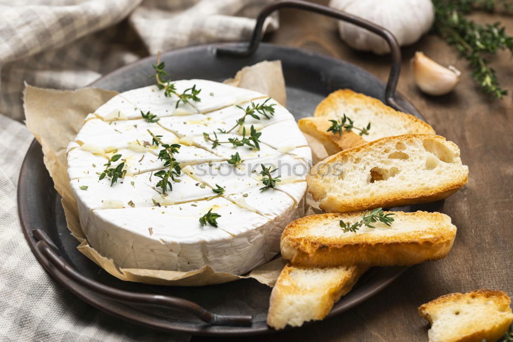 Similar – Image, Stock Photo Hummus in bowl and pita bread on white wooden table.