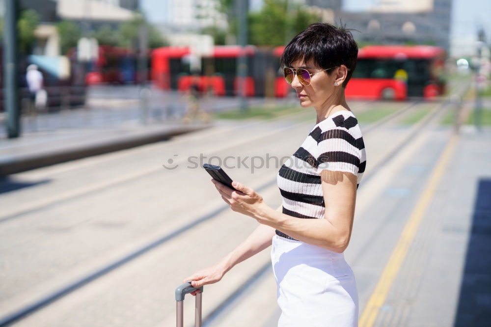 Similar – Image, Stock Photo Young woman with mobile phone at train station