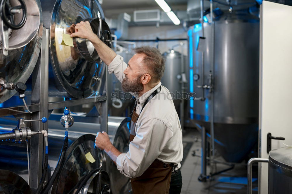 Similar – Image, Stock Photo female mechanic fixing a compressor enginge using a wrench