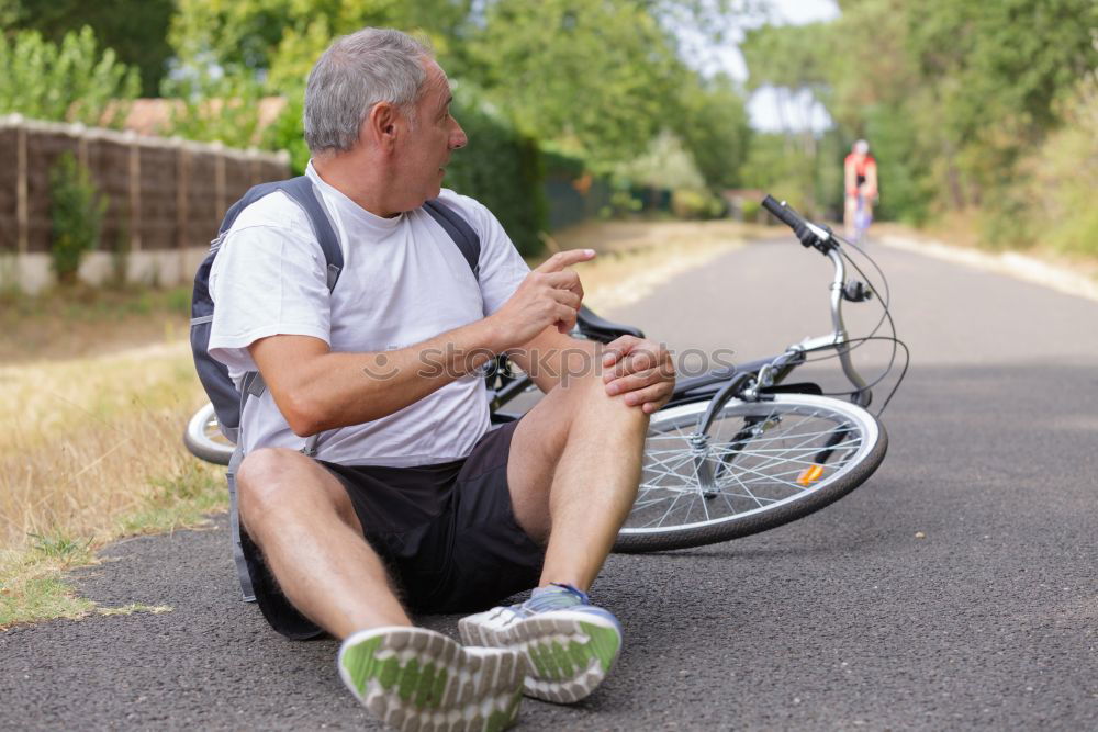 Similar – Foto Bild eine Frau hatte einen Unfall, sie ist mit einem Fahrrad gestürzt und hat sich verletzt