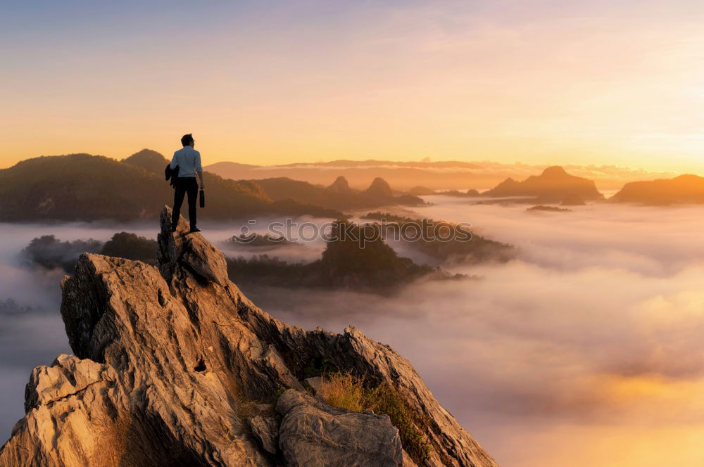 Similar – Stop climate catastrophe and turn around now. Person at Arthur’s Seat in Edinburgh in the fog